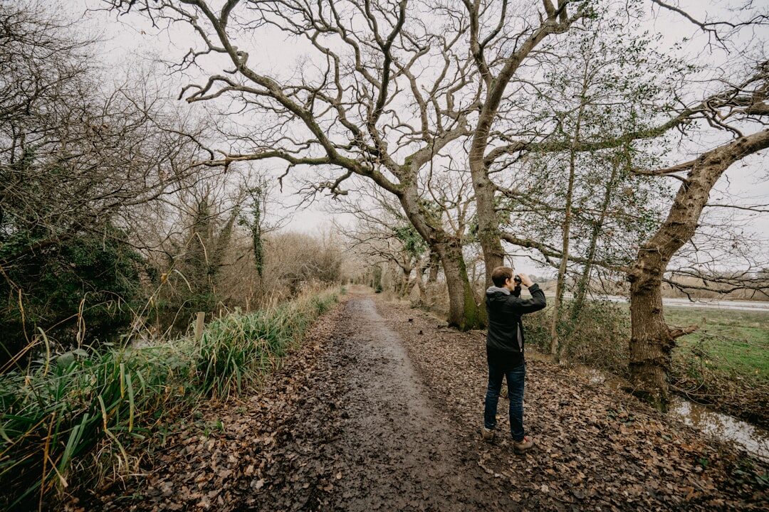 Photographer on assignment photographing outdoors in the countryside
