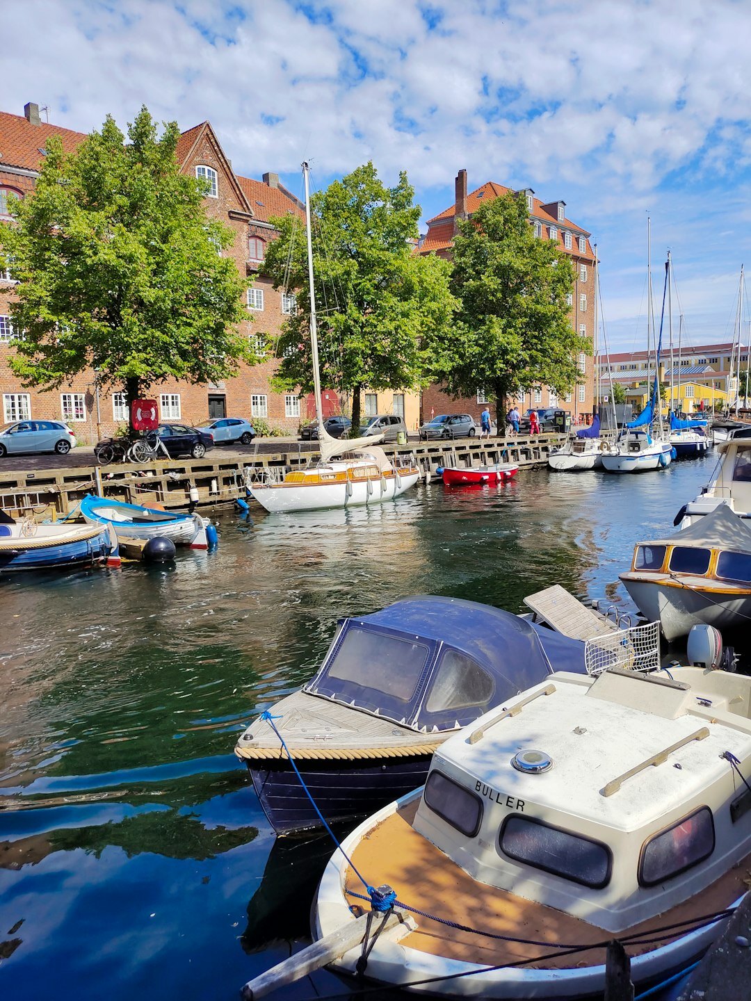Rows of small fishing boats moored in a Danish harbour