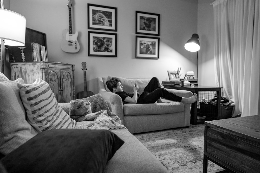 Photographer interviewing an elderly woman in her living room