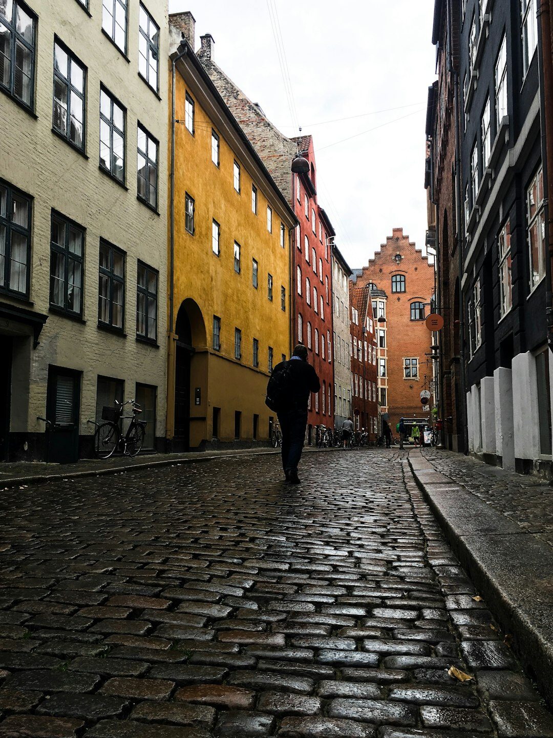 photographer walking through danish street