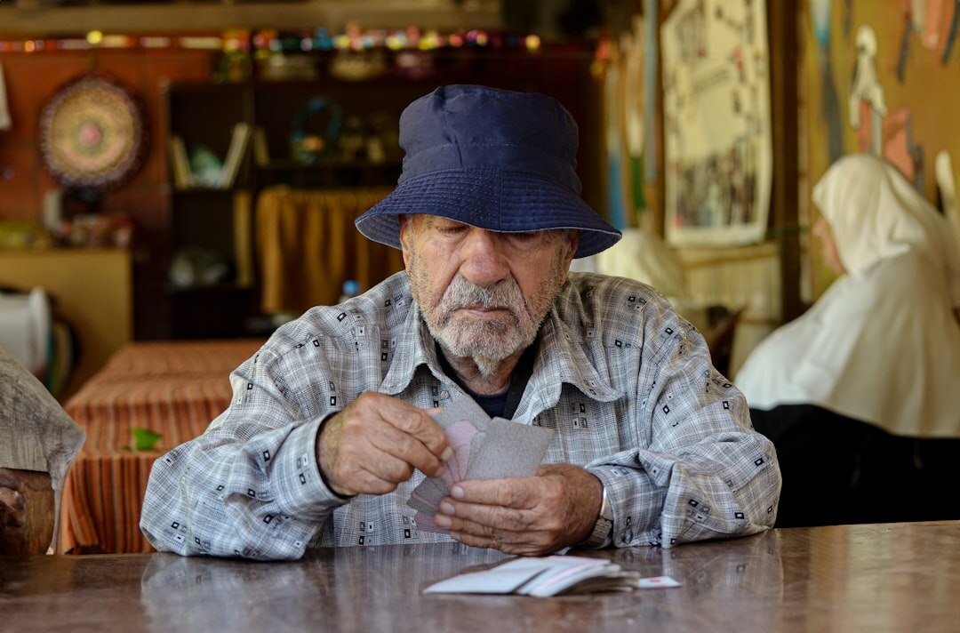 elderly men playing cards