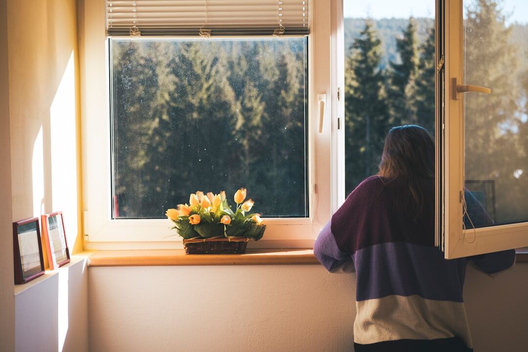 elderly woman by window