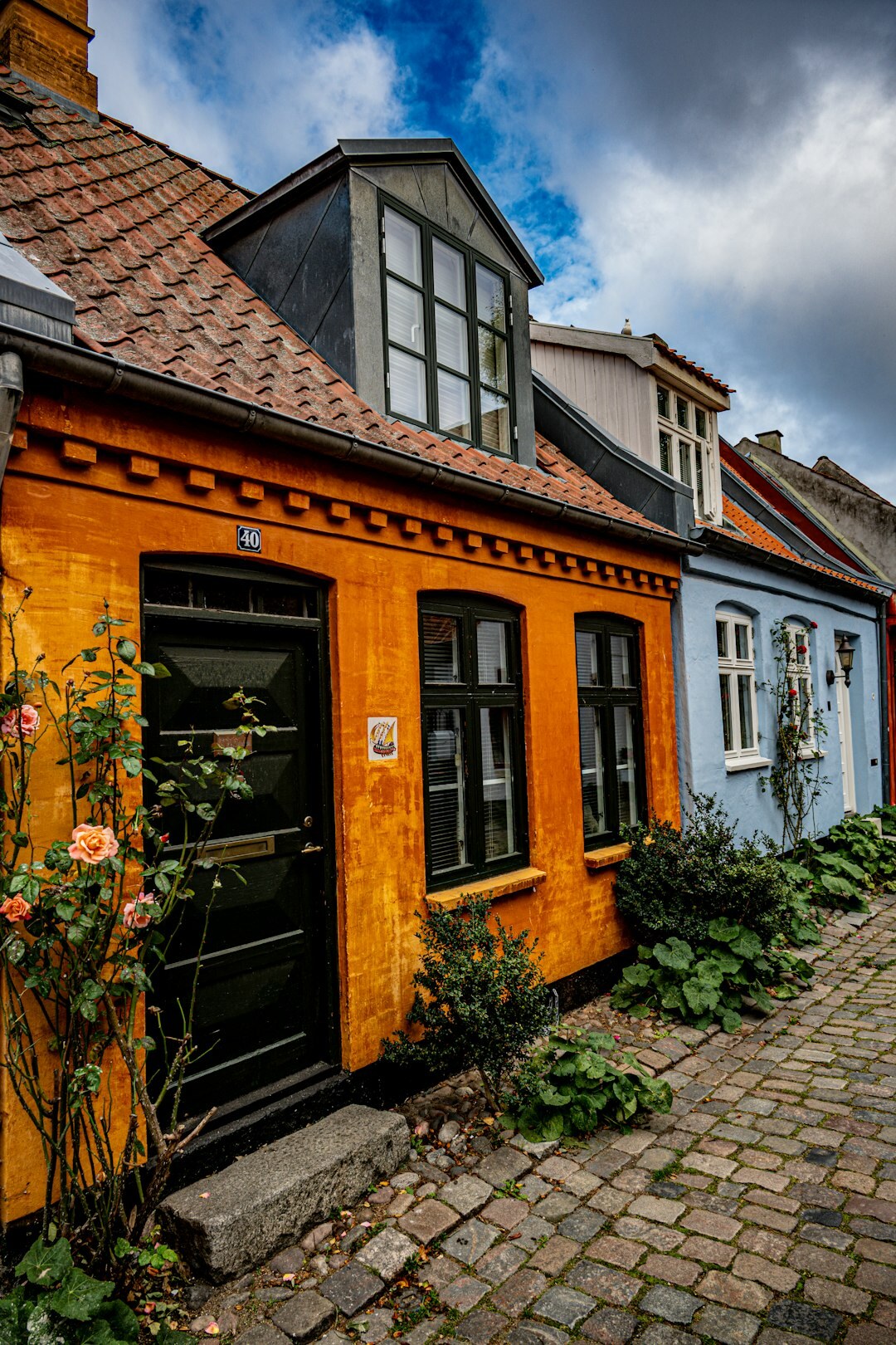 Children playing in a narrow street in a small Danish town